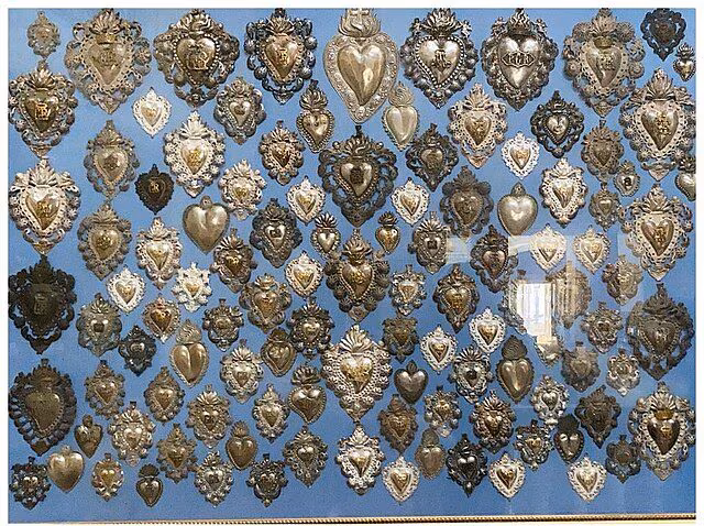 Hva er votivoffer og hva er deres opprinnelse: mening og funksjon